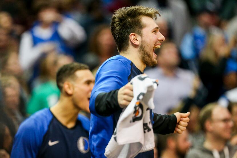 Dallas Mavericks guard Luka Doncic (77) reacts after Devin Harris scored to tie during an...