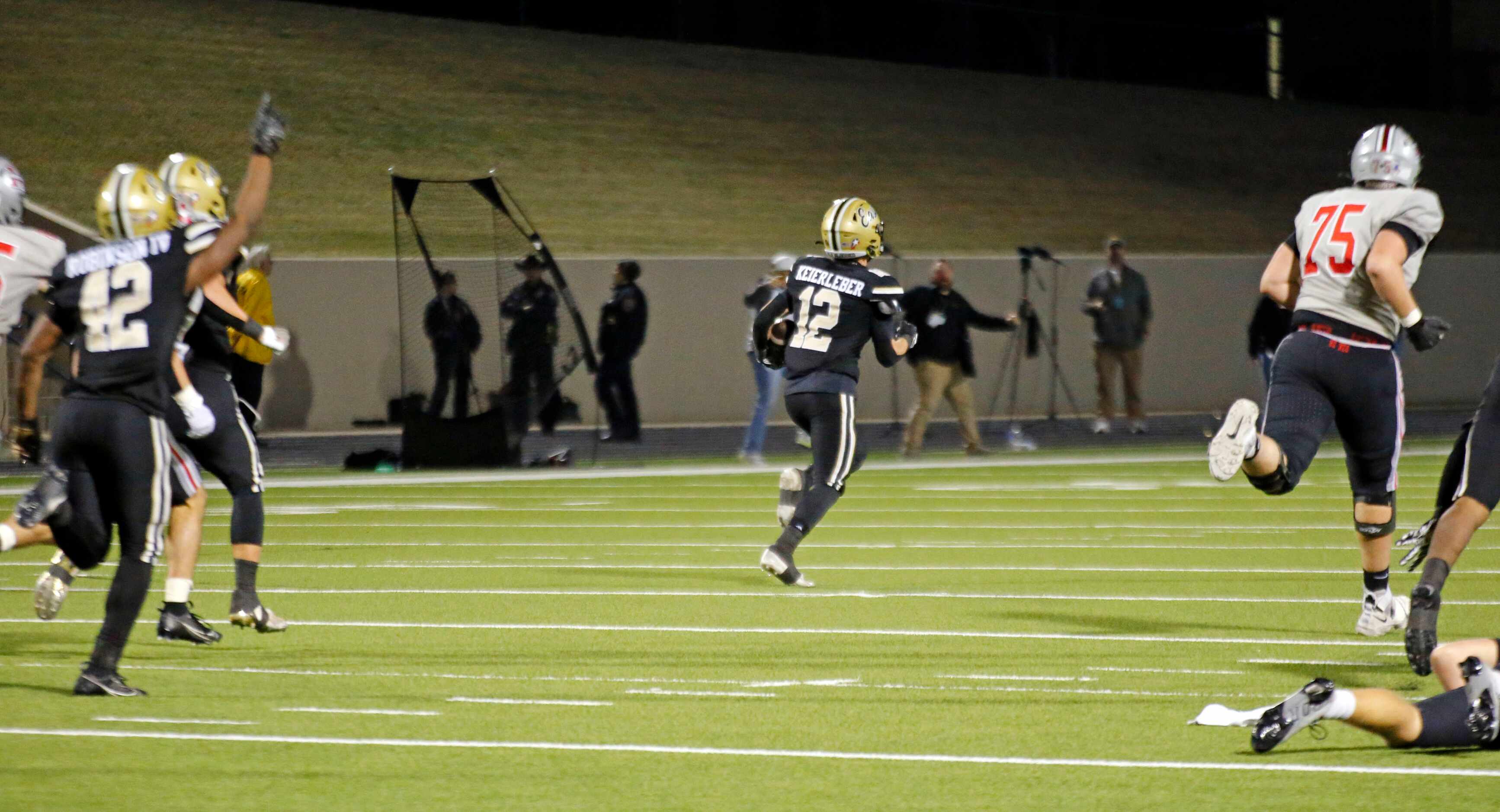 Plano East High player Kendall Keirleber (12) returns an interception for a touchdown during...