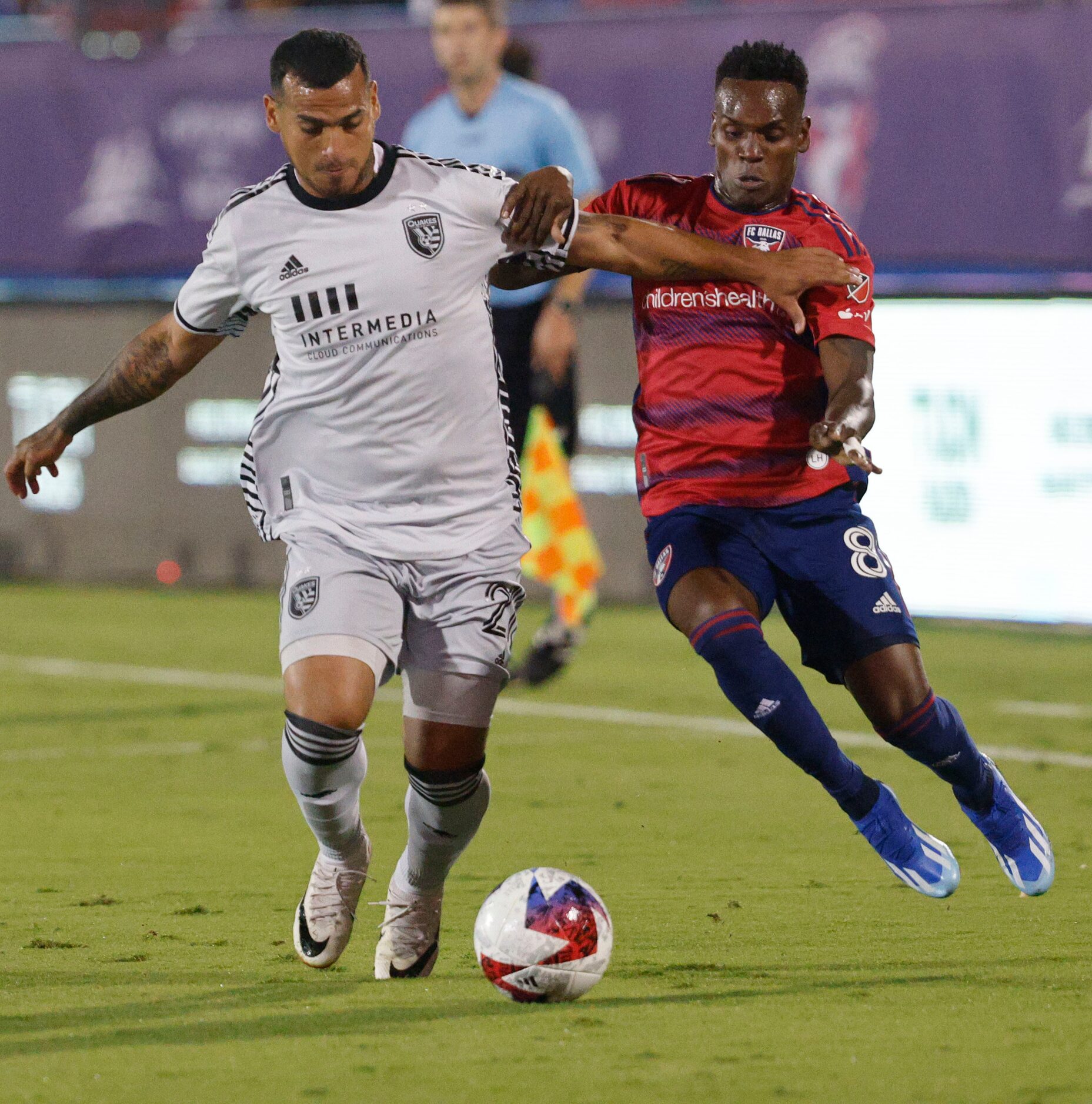 San Jose Earthquakes defender Miguel Trauco (21) and FC Dallas forward Jáder Obrian (8)...