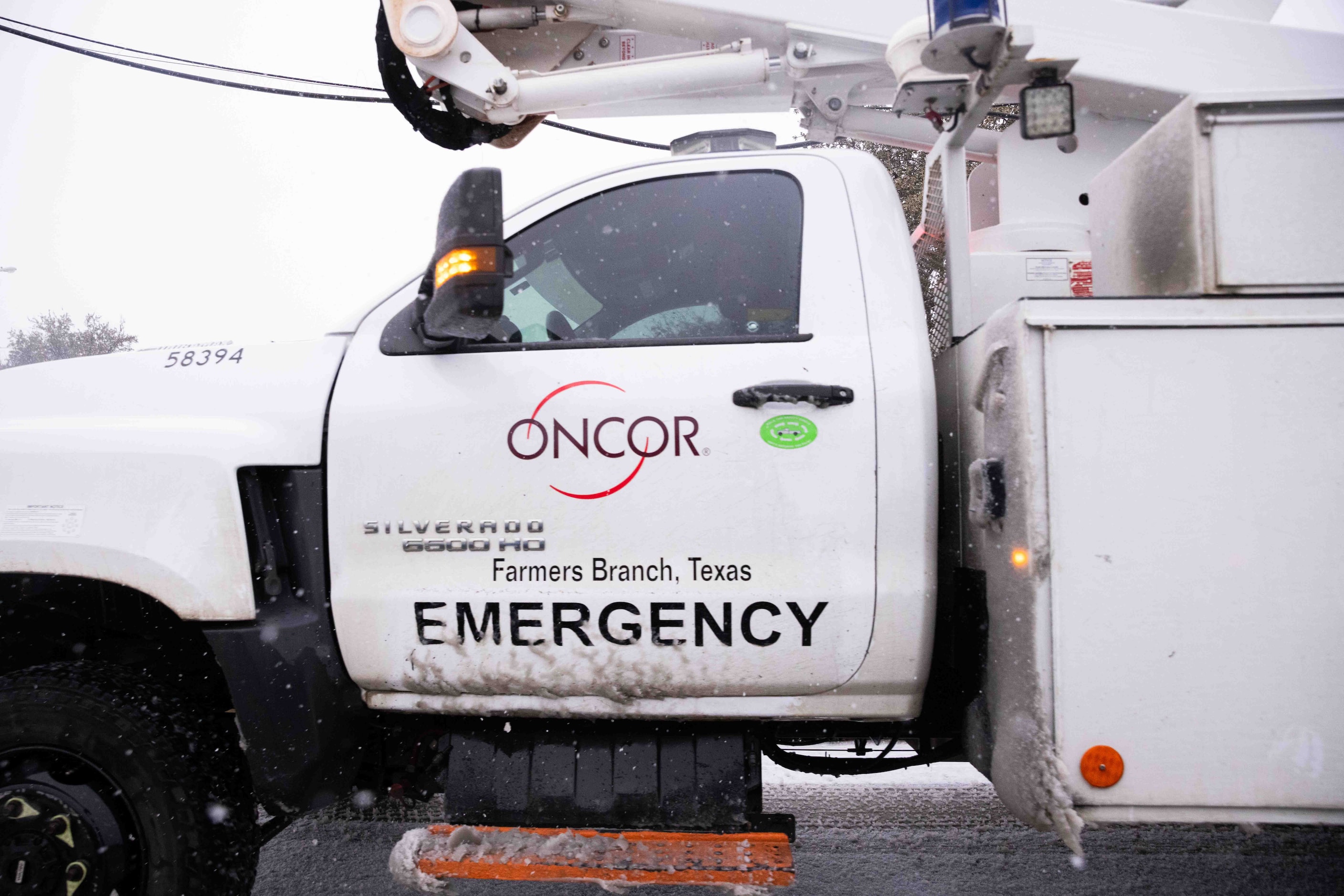 An Oncor emergency truck pulls into the Oncor Electric Delivery center in Dallas on...