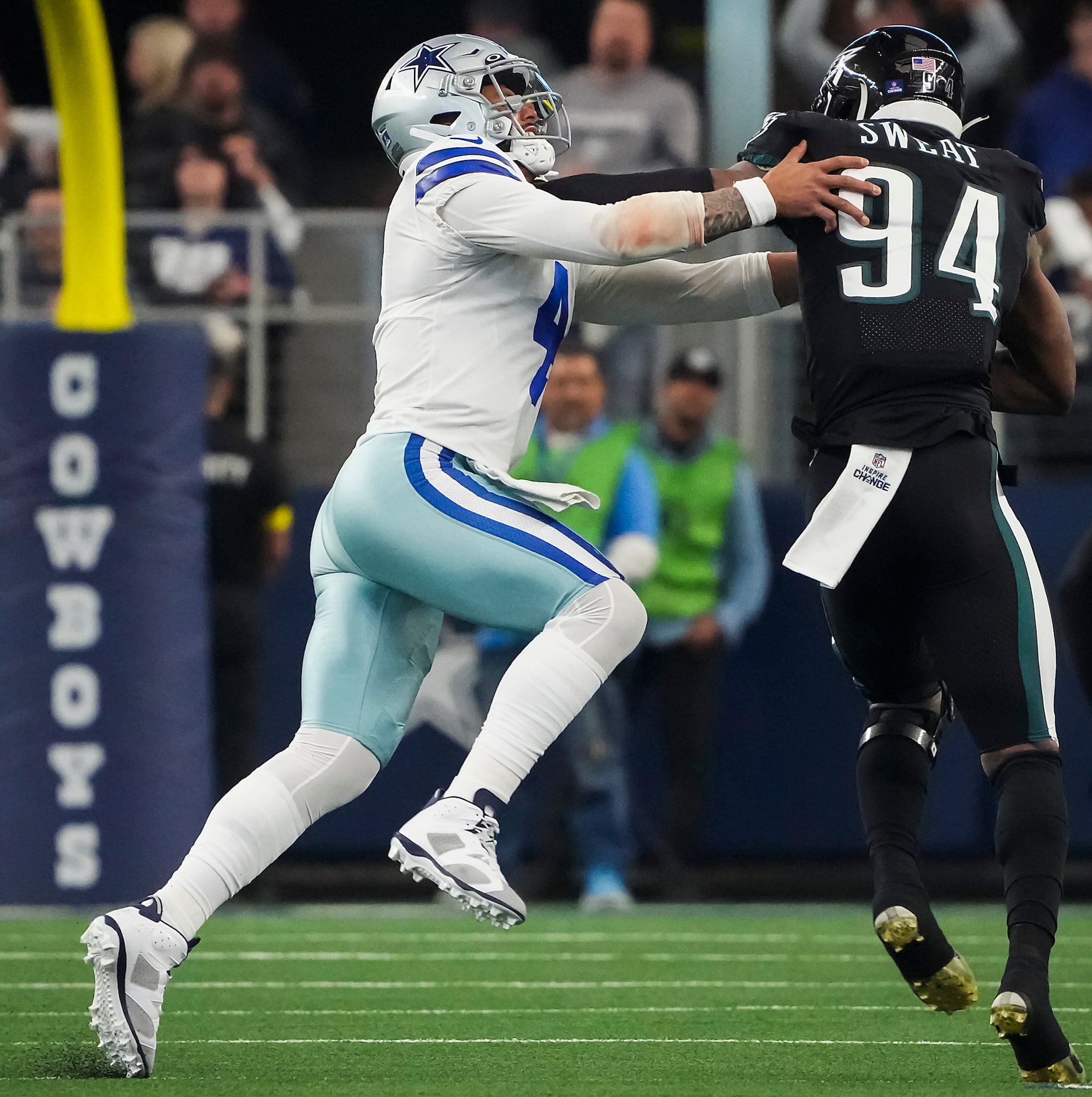 Philadelphia Eagles defensive end Josh Sweat (94) pushes past Dallas Cowboys quarterback Dak...