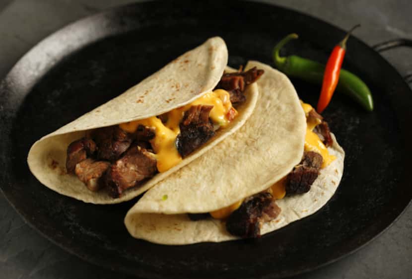Not just for chips: Try queso drizzled in soft tacos filled with beef brisket.