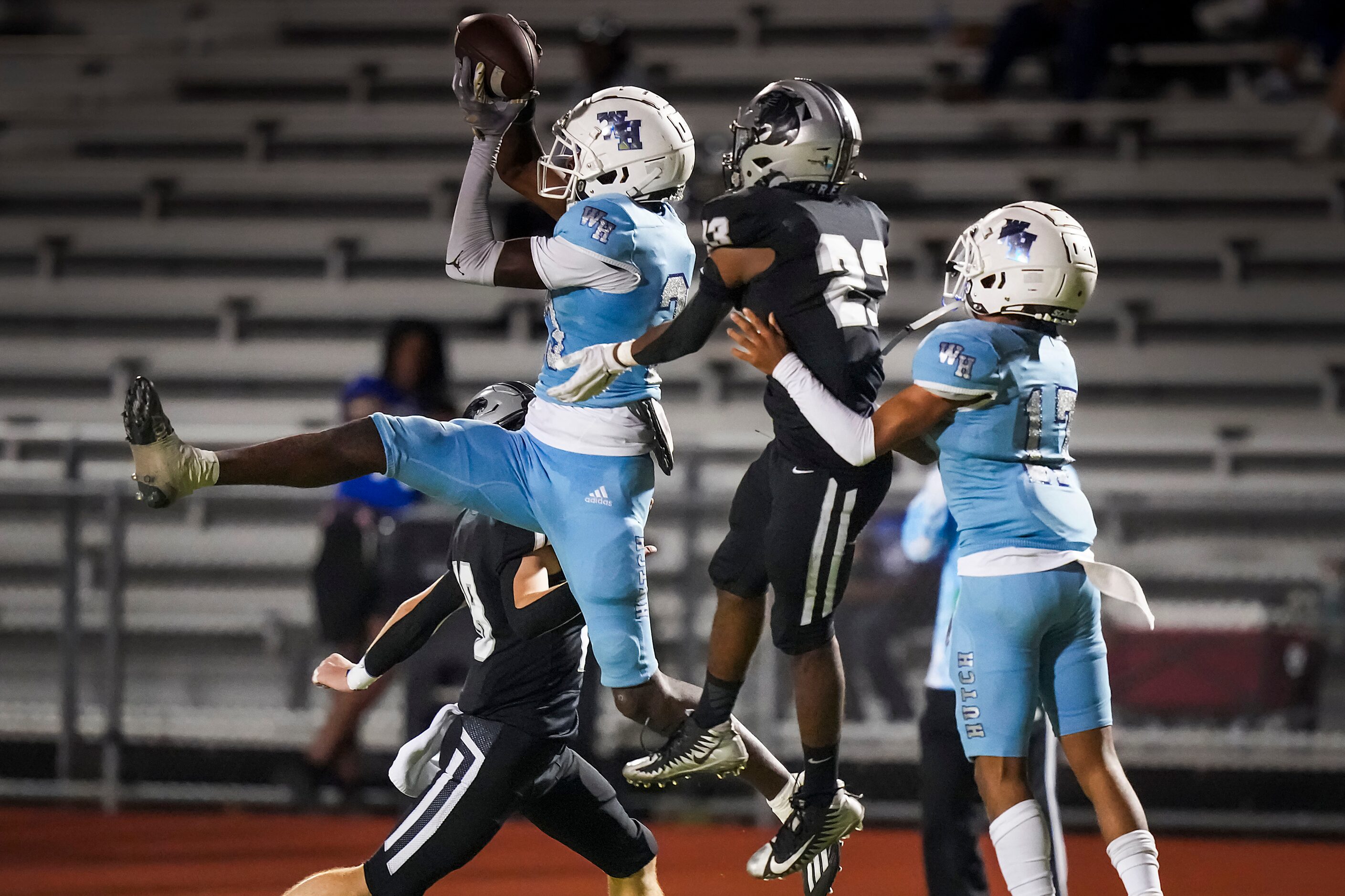 Wilmer-Hutchins wide receiver Jayvon Roe catches a pass as Panther Creek   defensive back...