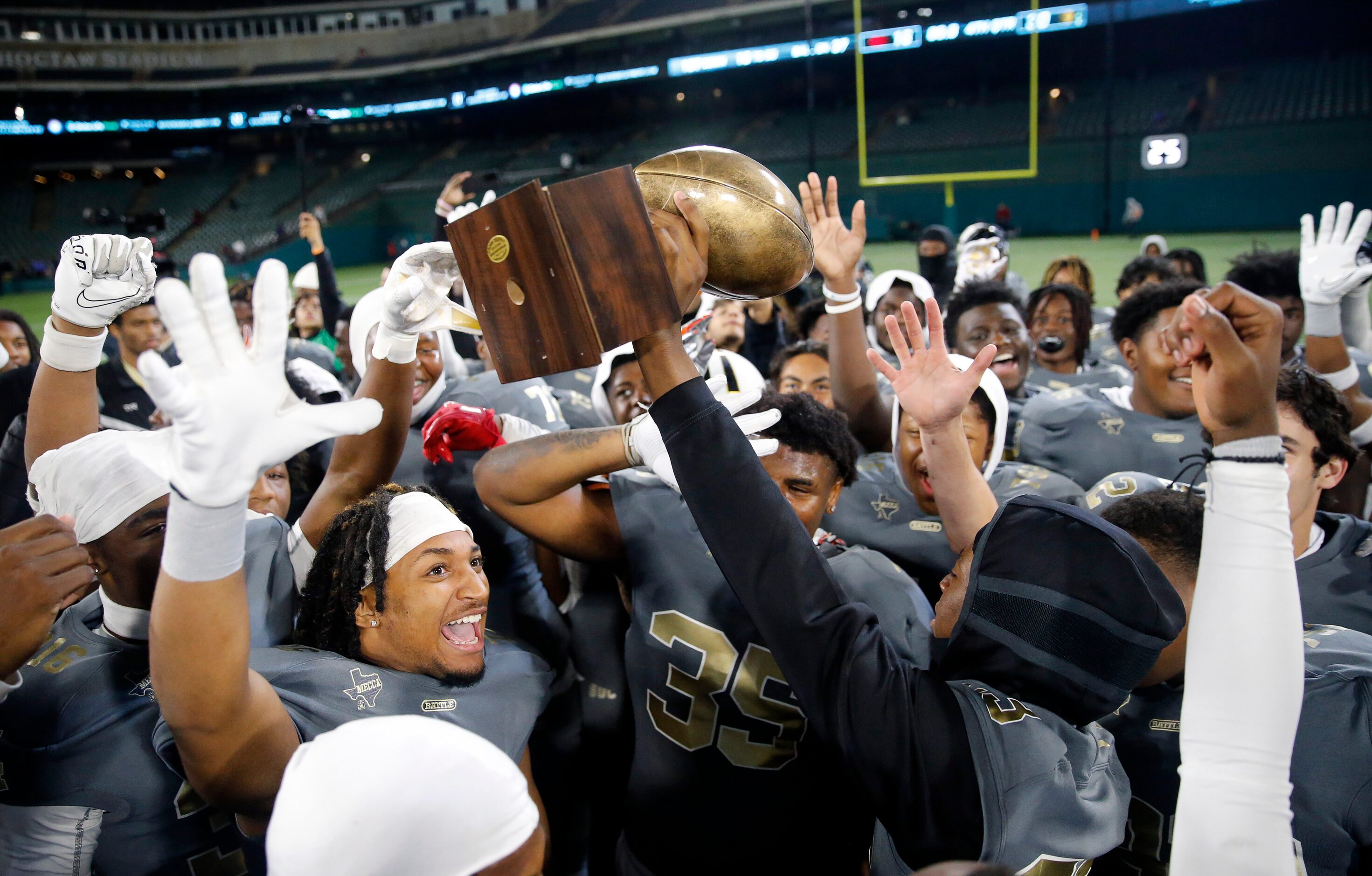 South Oak Cliff football players celebrate their Class 5A Division II Region II final win...