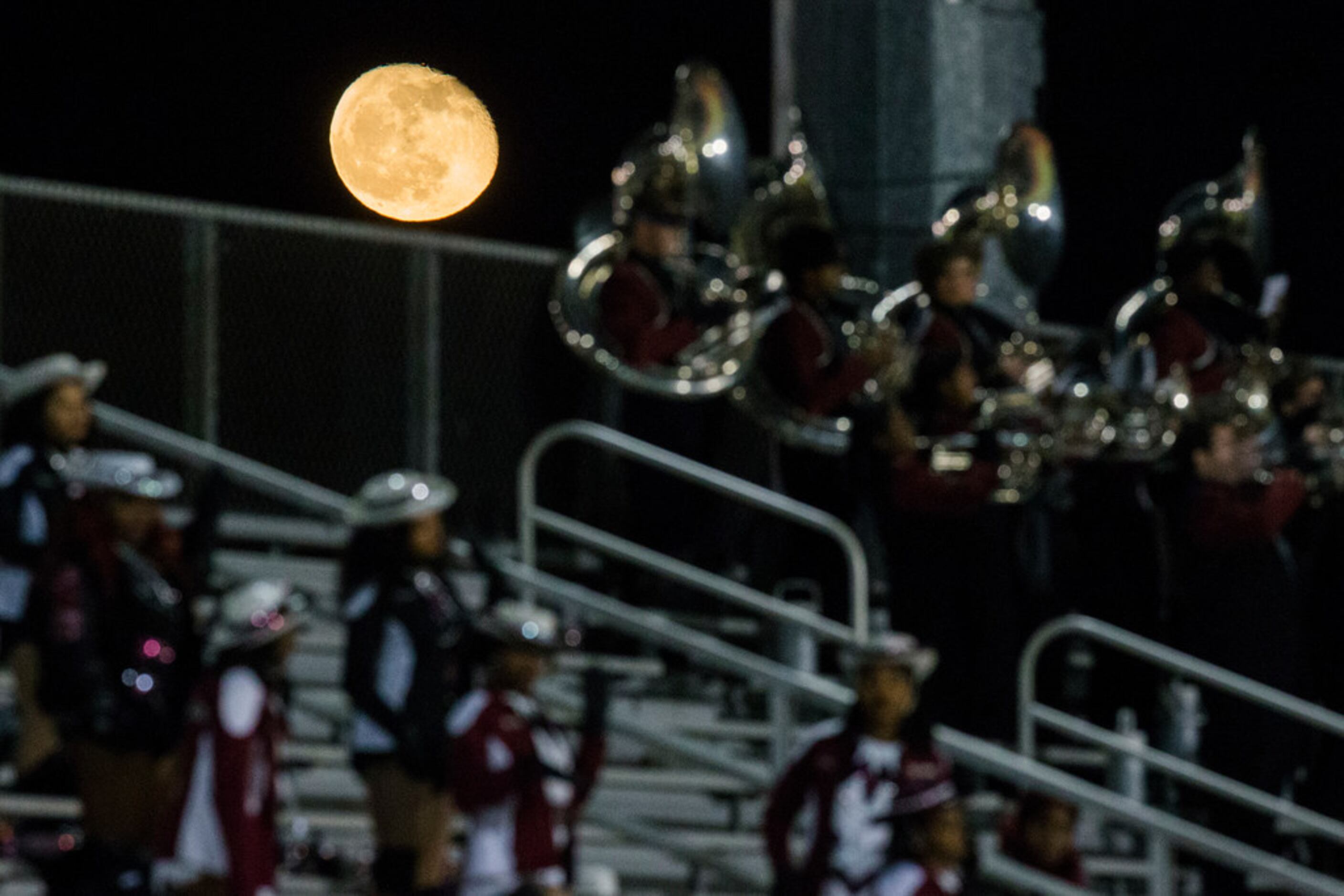 The moon rises over the Mansfield Timberview stands during the second quarter of a UIL Class...