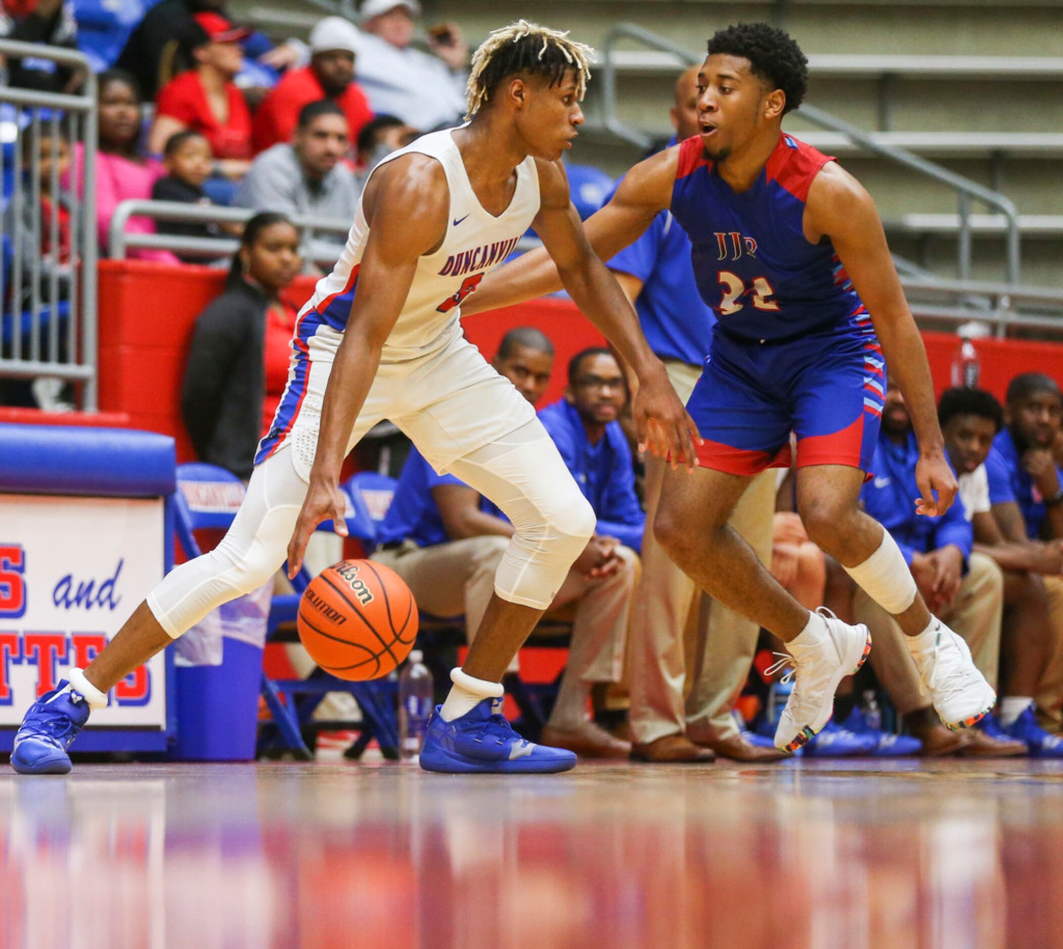 Duncanville guard Jahmius Ramsey (3) drives the ball past J. J. Pearce guard Braeson...