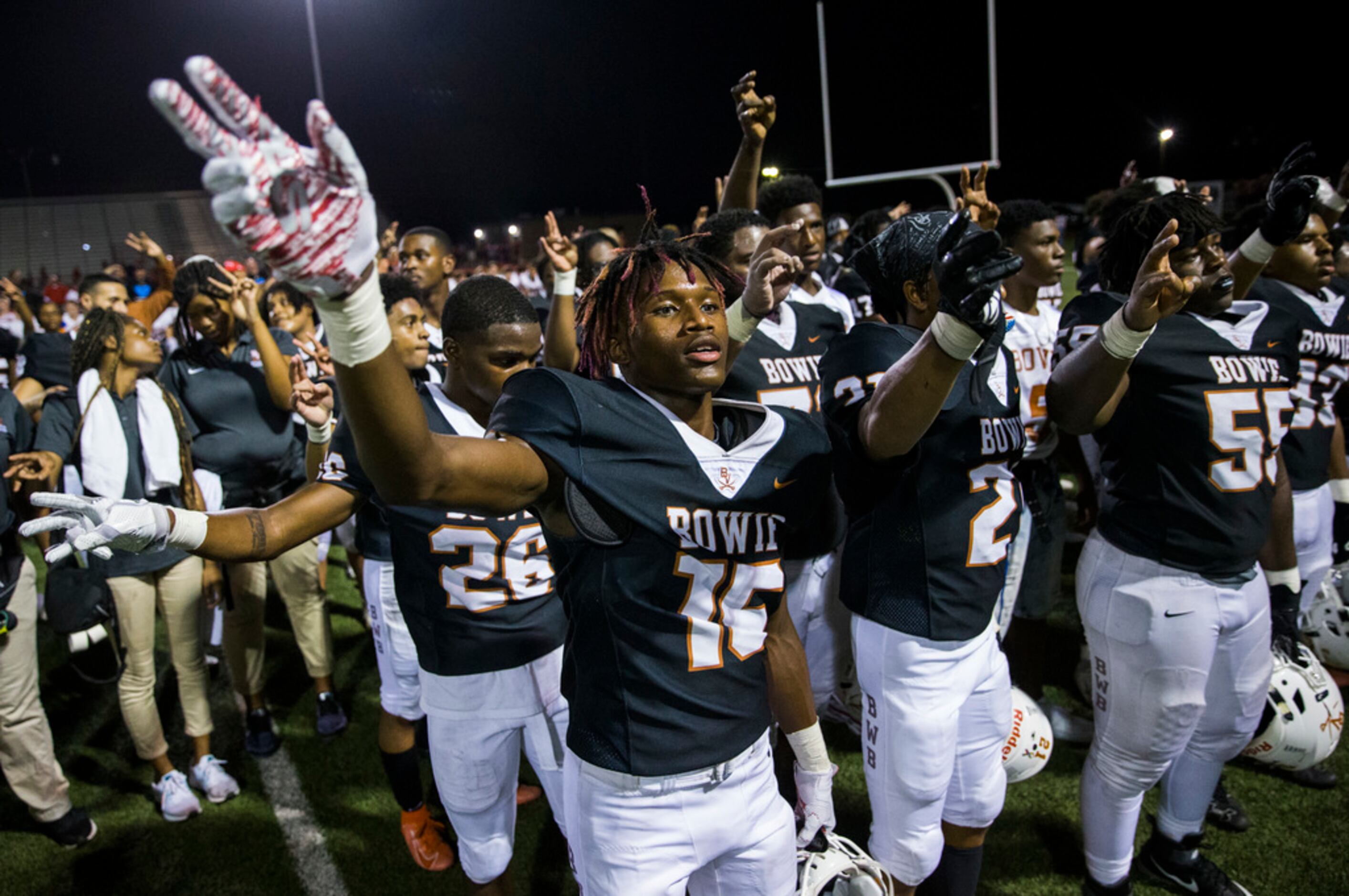 Arlington Bowie football players celebrate after a 28-14 win over Flower Mound Marcus on...