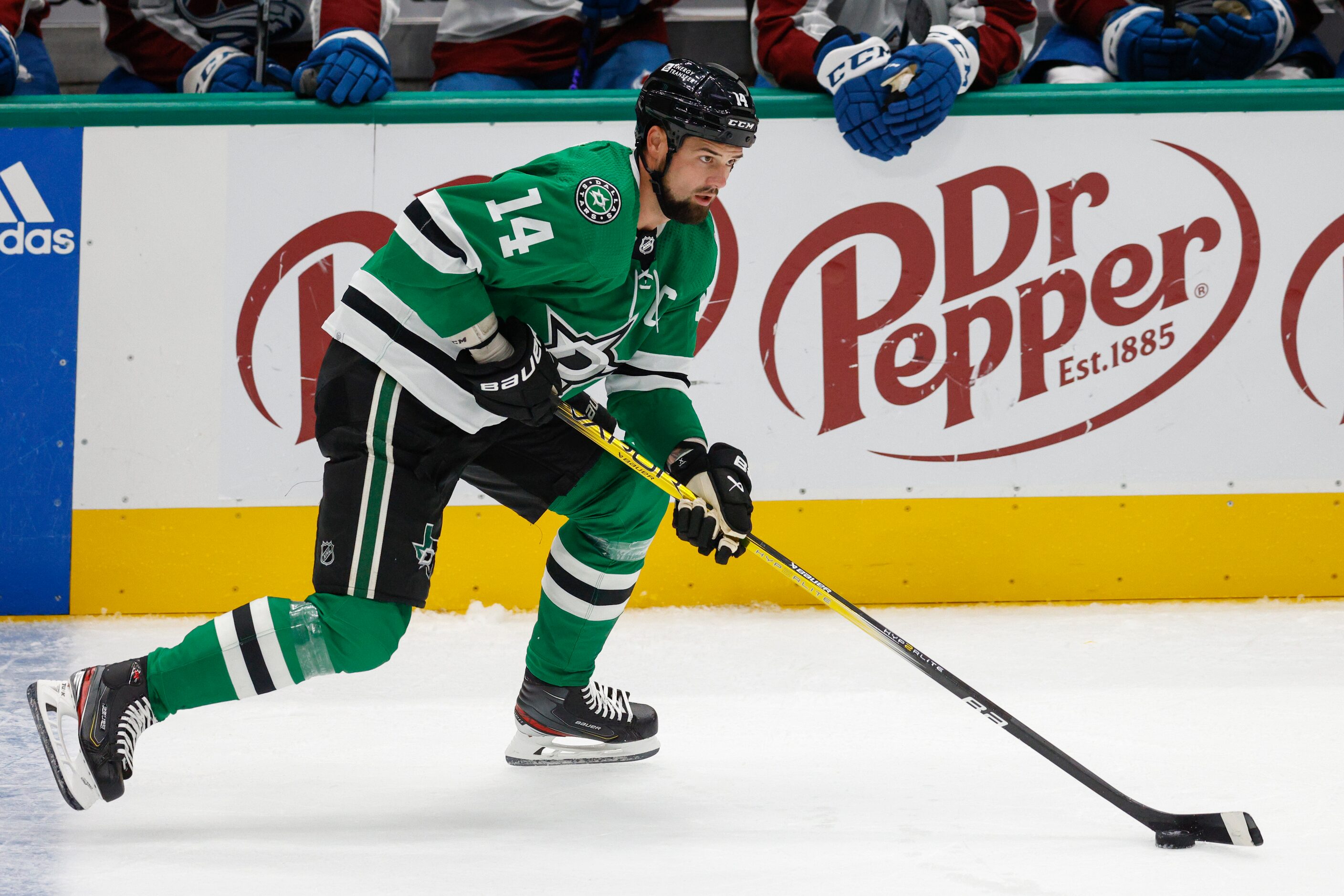 Dallas Stars left wing Jamie Benn (14) skates with the puck during the second period of an...