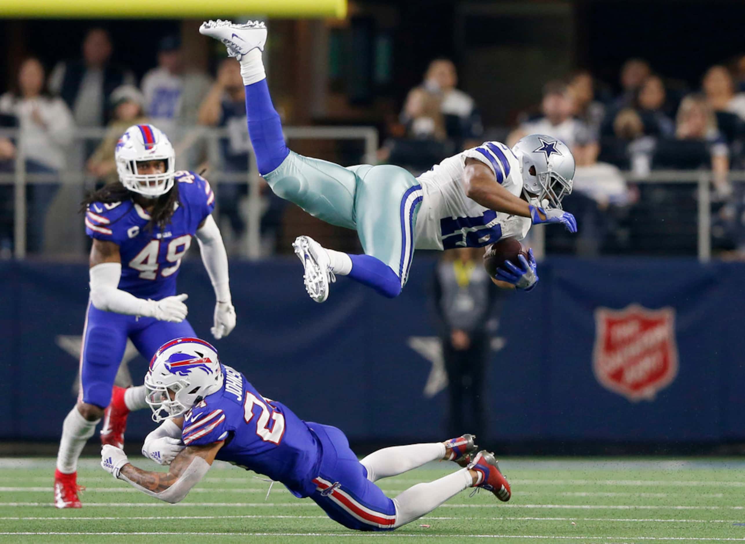 Dallas Cowboys wide receiver Amari Cooper (19) flies in the air after being hit by Buffalo...