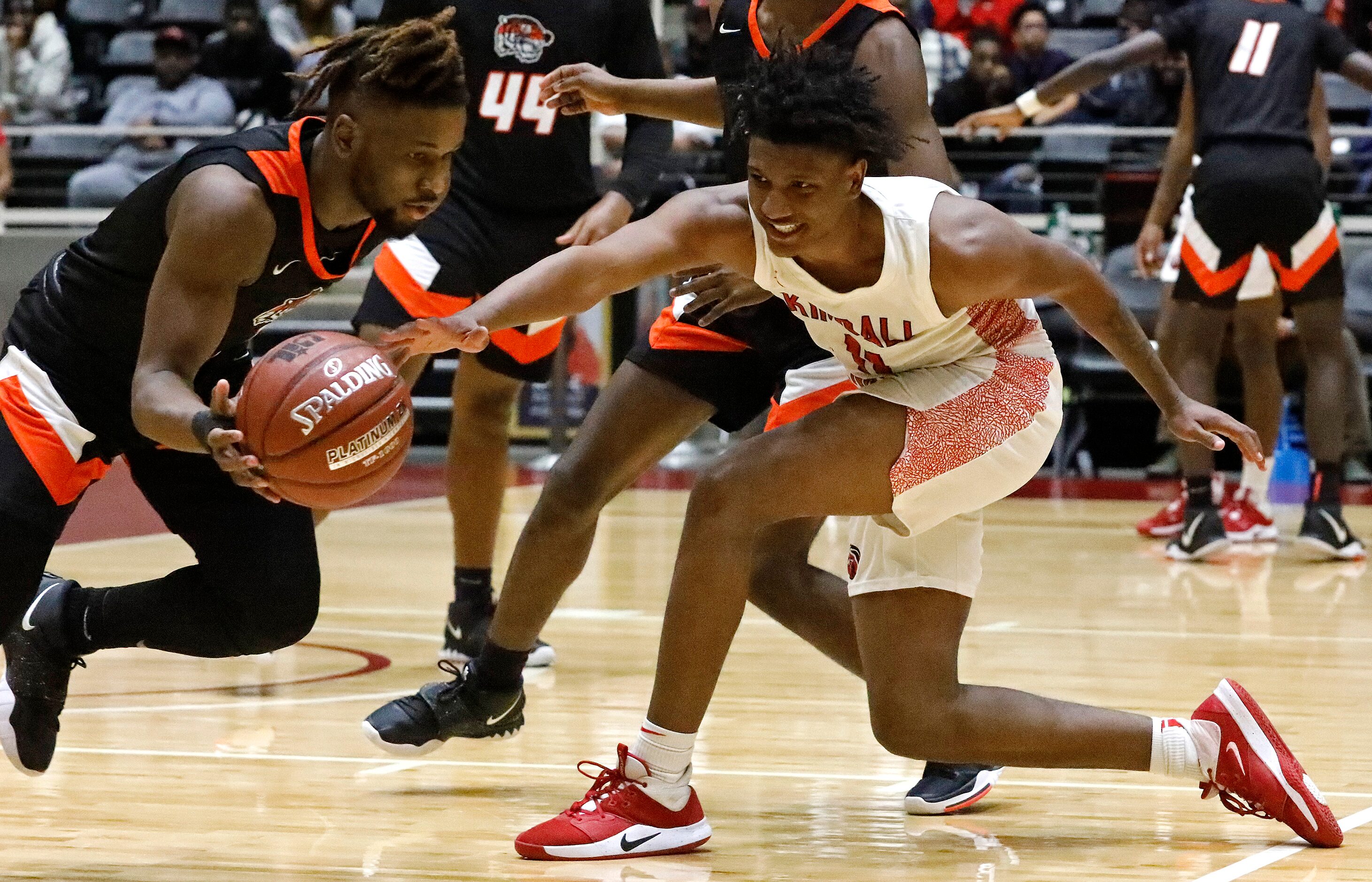 Lancaster High School guard Mike Miles (1) steals the ball from Kimball High School forward...