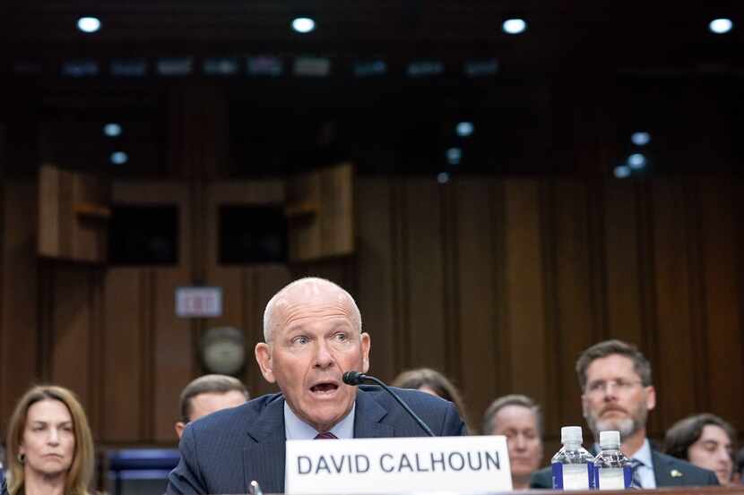 Boeing CEO David Calhoun, center, testifies at a Senate Homeland Security Subcommittee on...