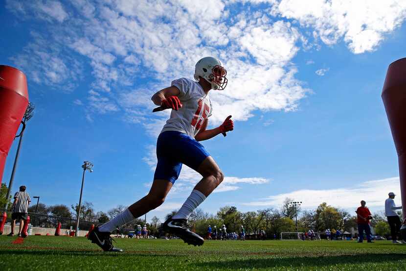 SMU wide receiver Alex Honey goes through a drill during the first spring practice of the...