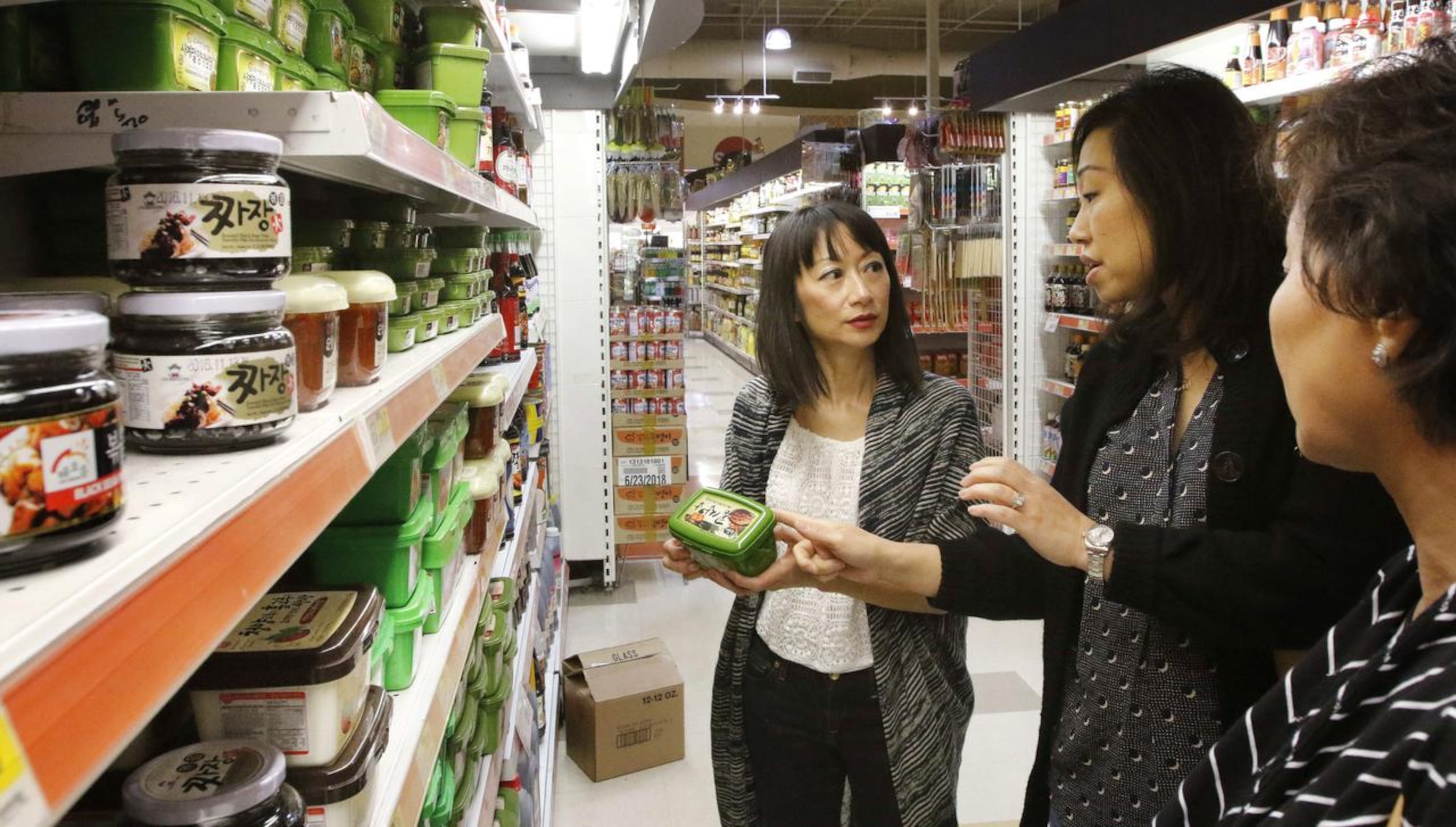 
Cheryl Collett, Hyejon Ko-Suk and Lisa Shin shop at H Mart in Korean town in Carrollton.
