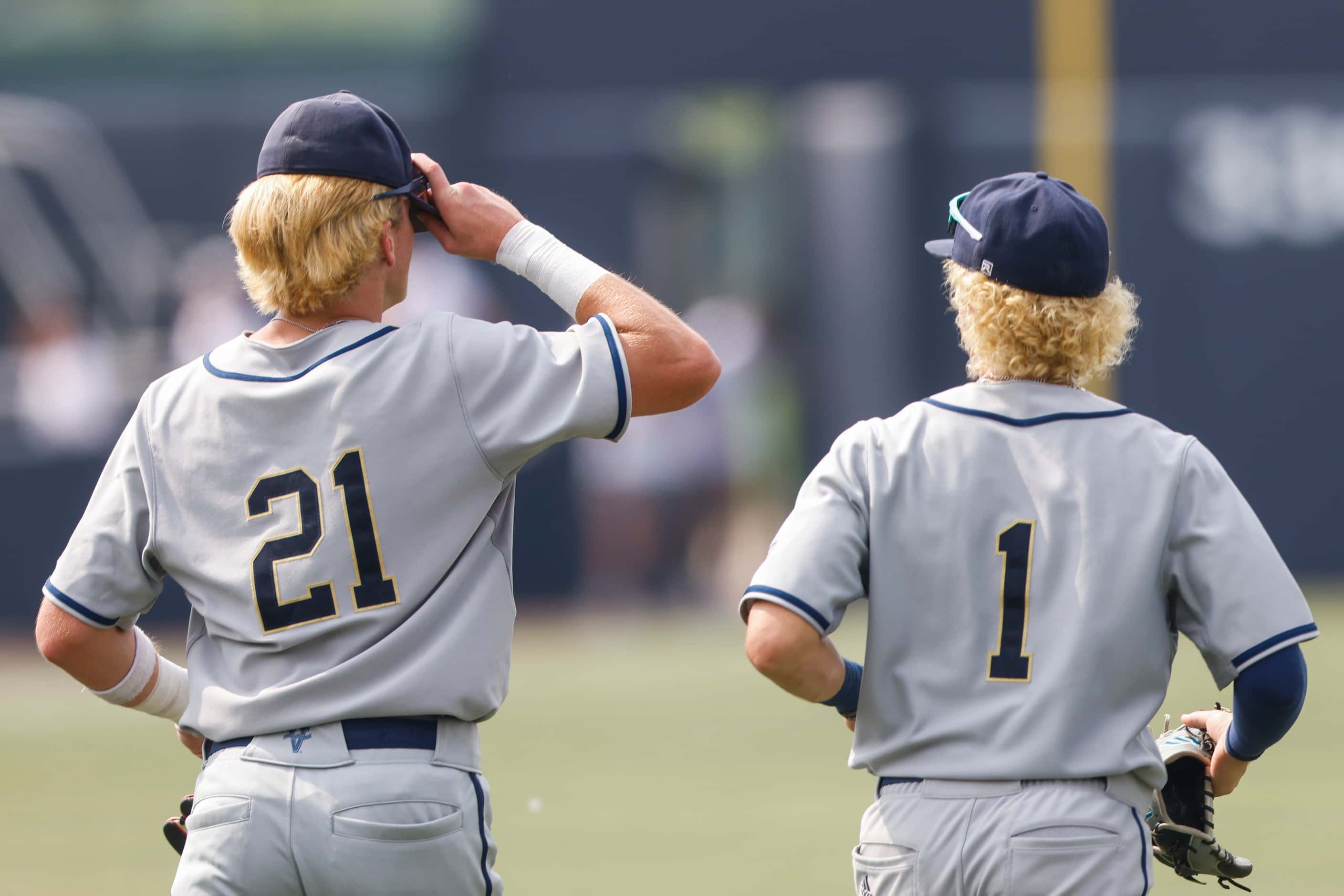 Keller’s Cole Koeninger (21) and Bach Hartwig (1) sport matching hair color during Game 3 of...