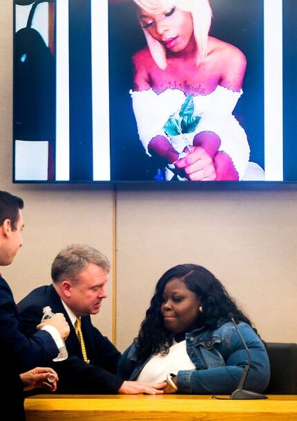 Prosecutor Jason Hermus speaks to Muhlaysia Booker's mother, Stephanie Houston, on Wednesday...