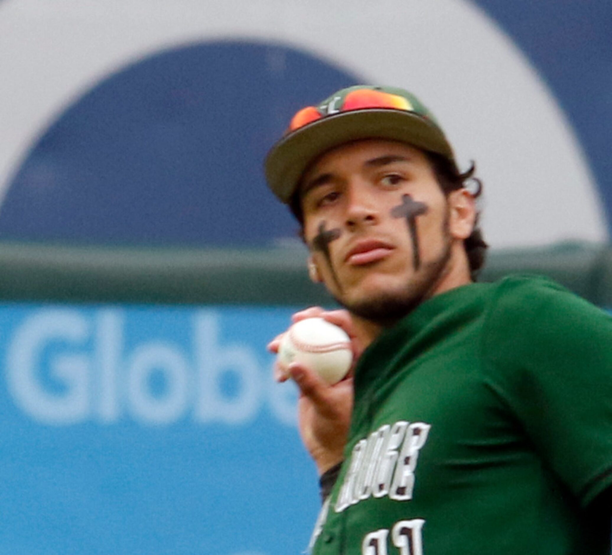 Mansfield Lake Ridge center fielder Connor Ramirez (11) returns the ball to the infield...