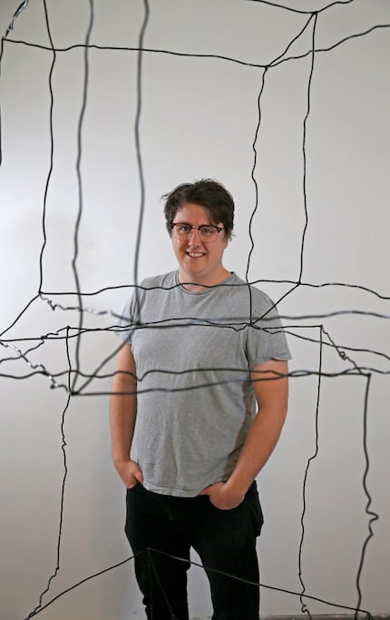 Artist Shelby David Meier poses for a photograph at his exhibit "The Difference Between a...