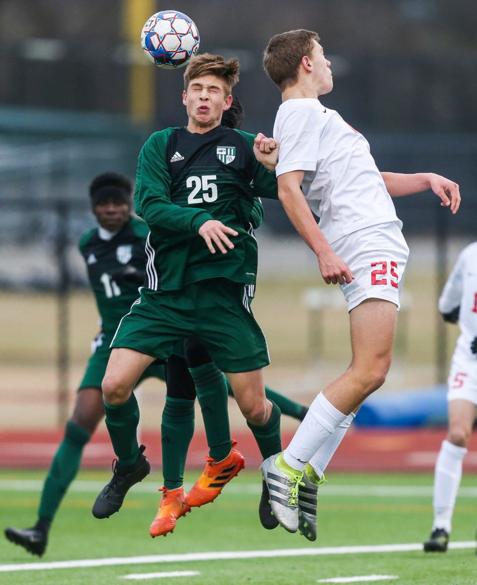 Proper's Cole Newman (25) heads the ball past Allen's Greyson Golgert (25) during Prosper's...