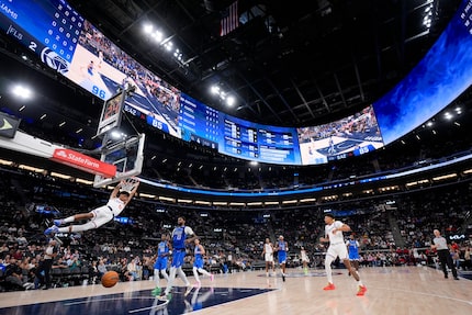 Los Angeles Clippers' Cam Christie (12) makes a dunk during the second half of an NBA...