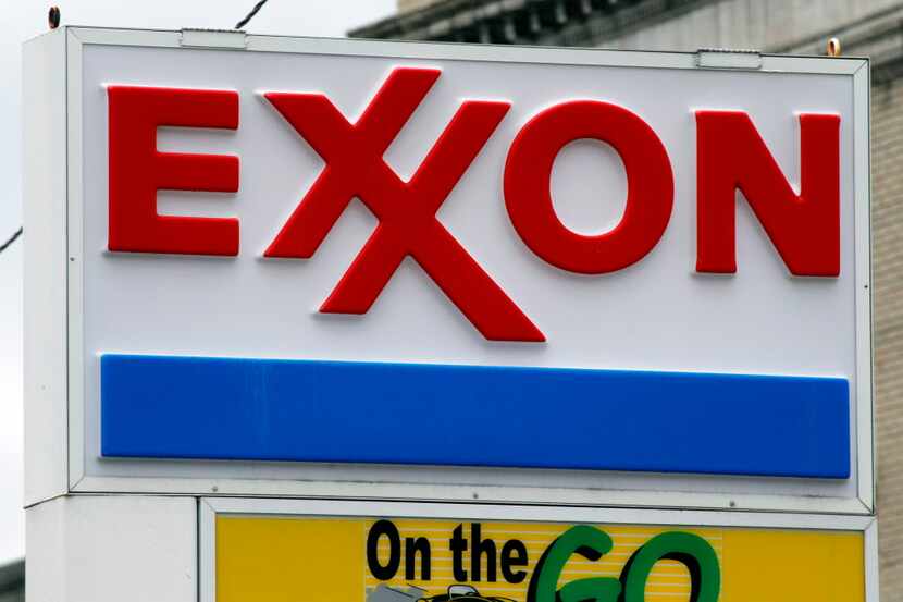 FILE - This April 29, 2014, file photo shows an Exxon sign at a mini-mart in Dormont, Pa. ...