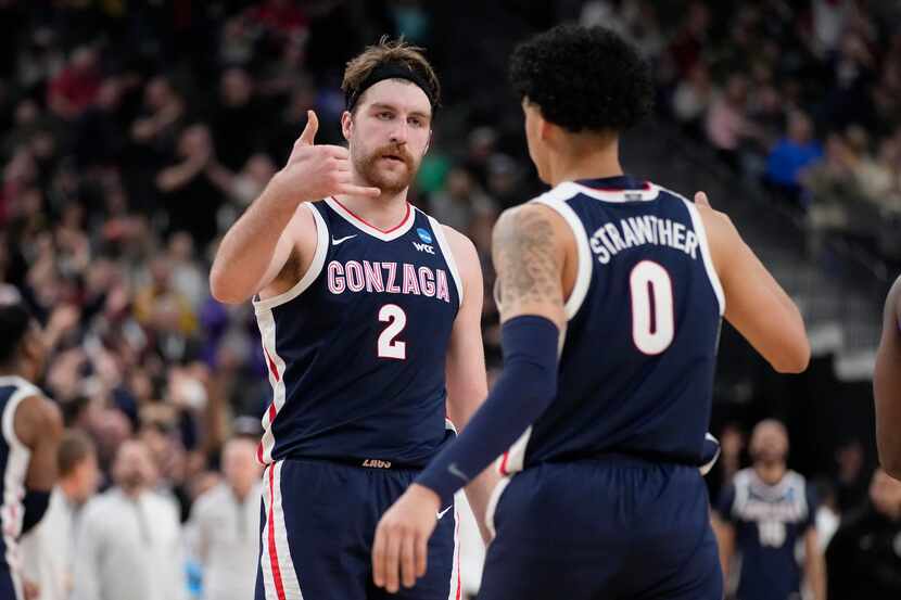 Gonzaga's Drew Timme (2) and Julian Strawther (0) celebrate in the second half of a Sweet 16...