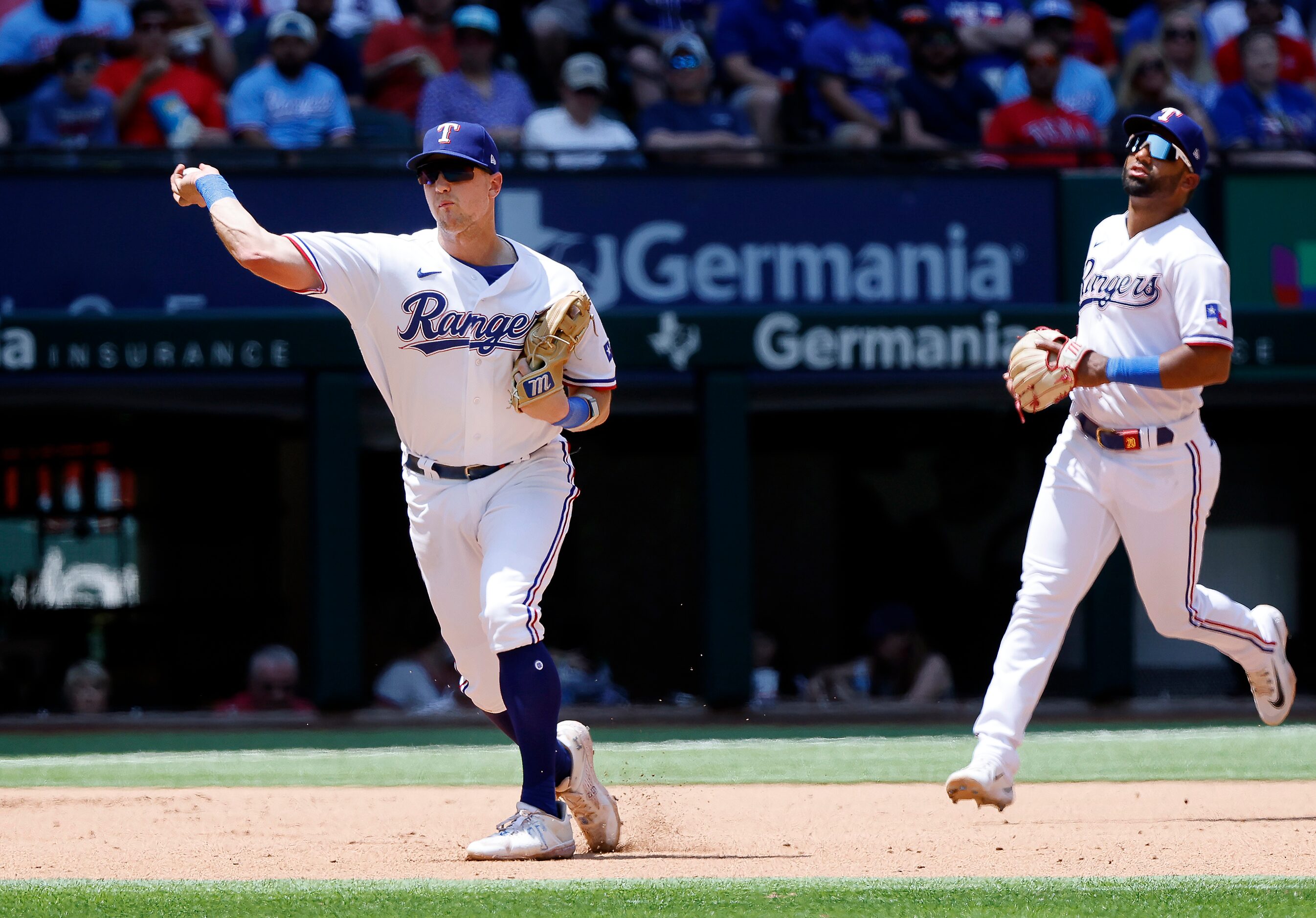 Texas Rangers third baseman Josh Jung (6) fields a grounder and throws out Arizona...