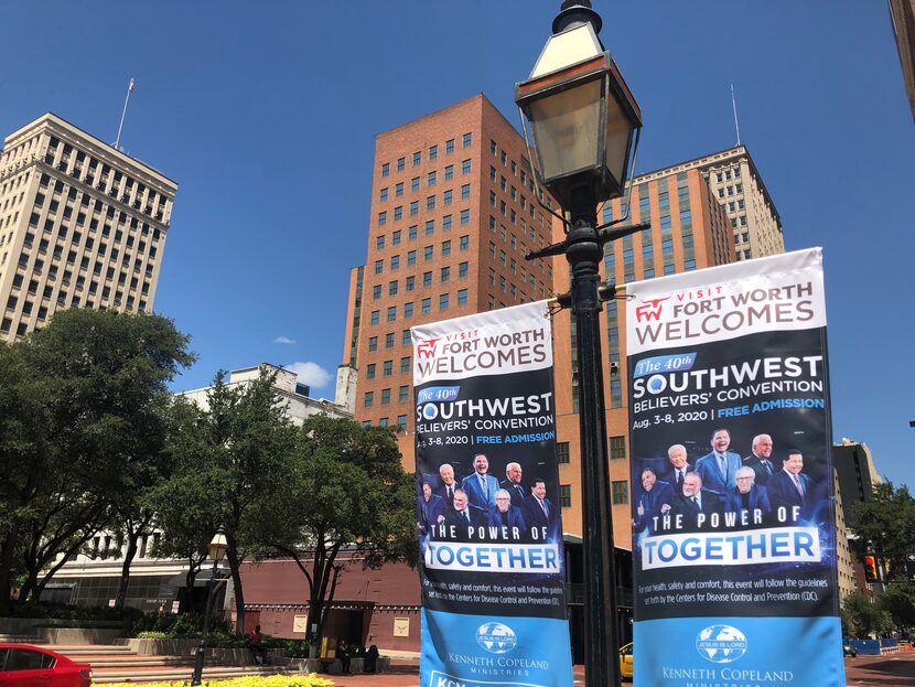 Banners for Kenneth Copeland's religious revival hang on Fort Worth streets. The event was...