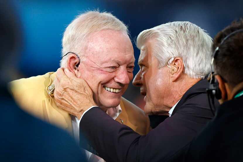 Dallas Cowboys owner Jerry Jones (left) and his former head coach Jimmy Johnson embrace on...