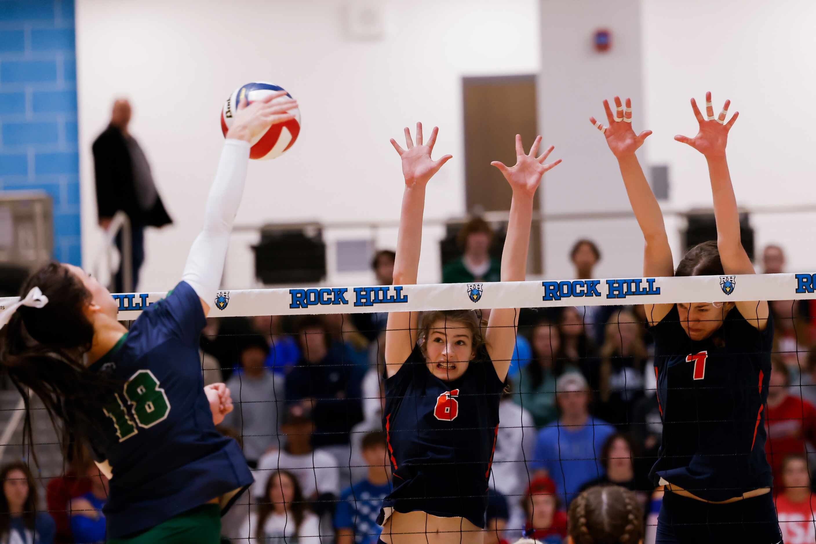 Frisco Reedy’s Halle Schroder hits the ball against Frisco Wakeland’s Hannah Lee (6) and...