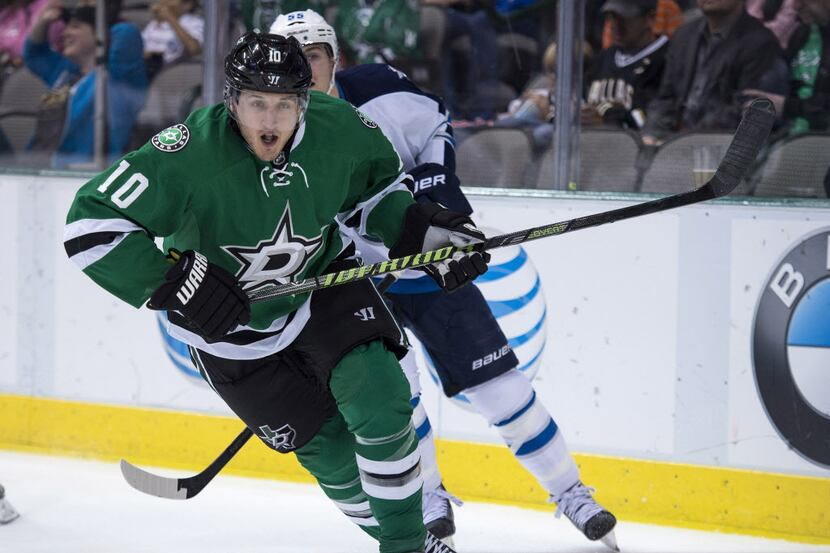 Oct 26, 2013; Dallas, TX, USA; Dallas Stars center Shawn Horcoff (10) chases the puck in the...