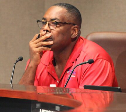 Plano Mayor Harry LaRosiliere listens to The Turning Point executive director speak from the...