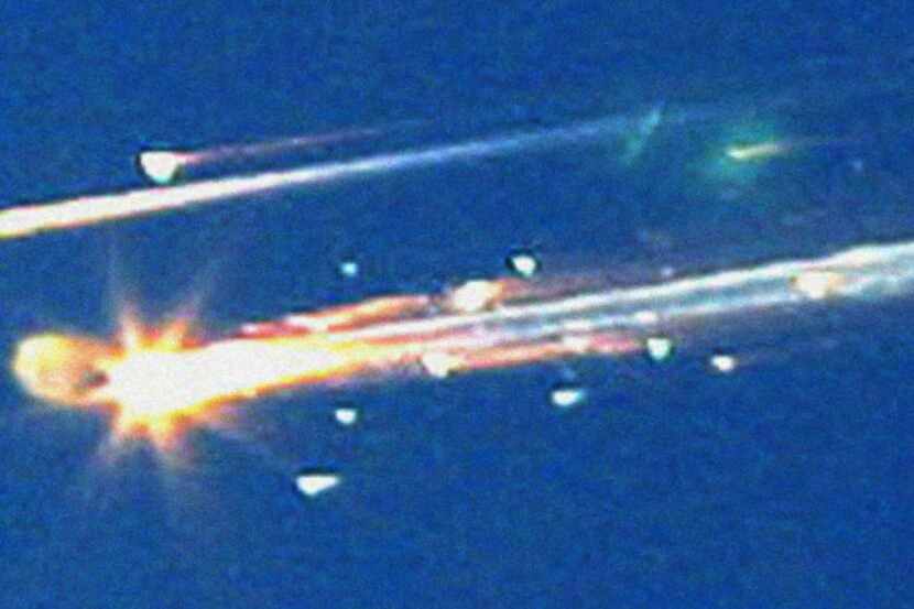 Debris from the space shuttle Columbia streaks across the sky over Tyler on Feb. 1, 2003.