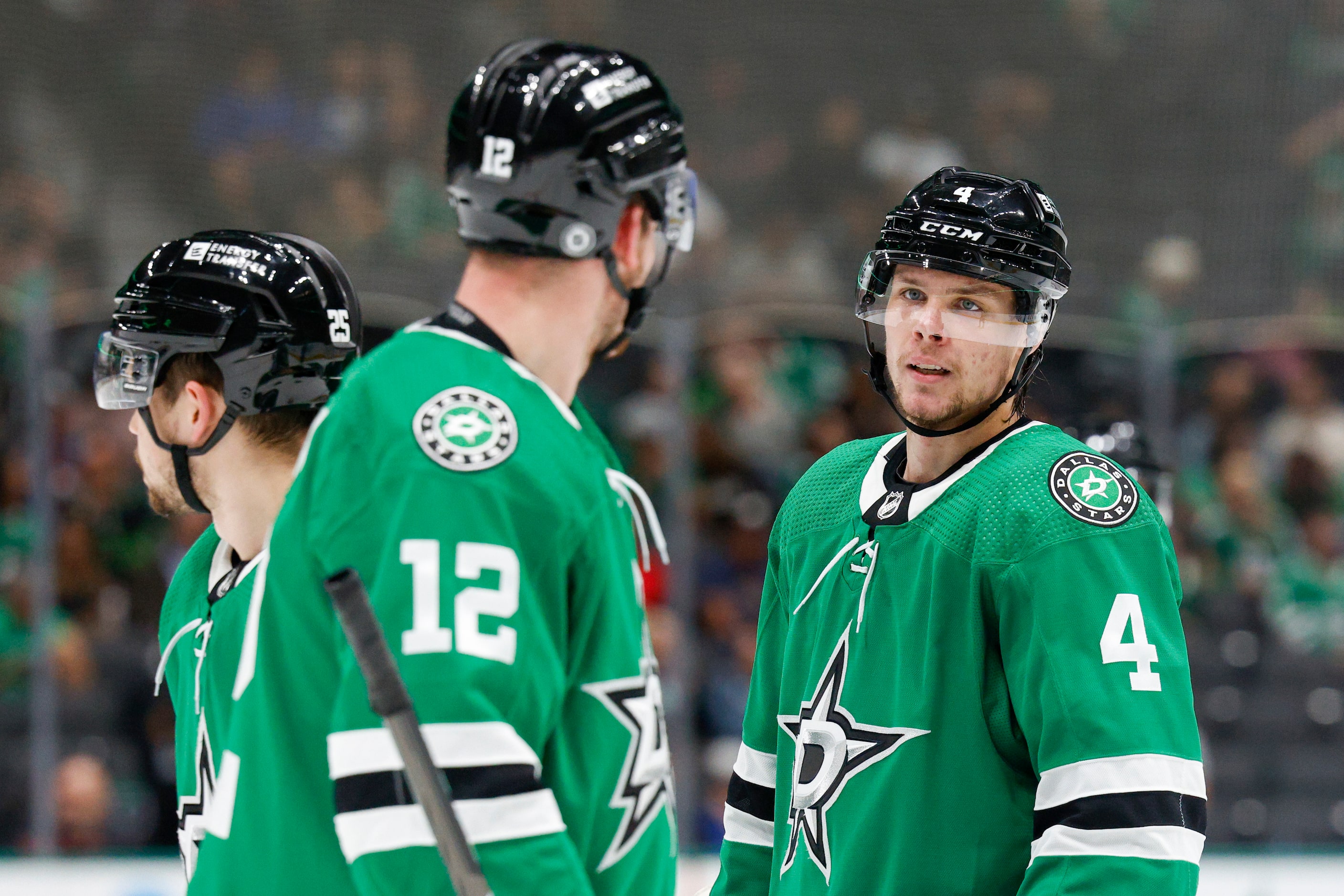 Dallas Stars center Radek Faksa (12) talks with defenseman Miro Heiskanen (4) during the...