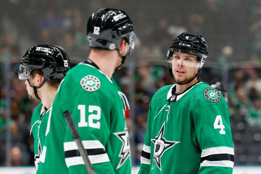 Dallas Stars center Radek Faksa (12) talks with defenseman Miro Heiskanen (4) during the...