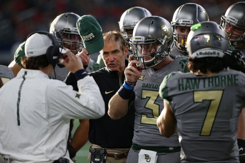 Baylor Bears head coach Art Briles speaks to players in the second half during an NCAA...