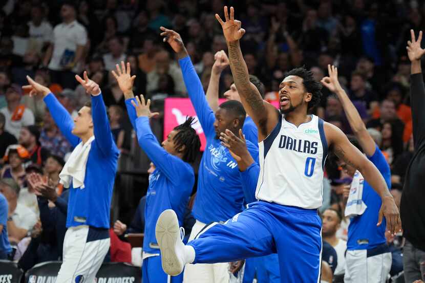 Dallas Mavericks forward Sterling Brown (0) celebrates a 3-pointer by forward Reggie Bullock...