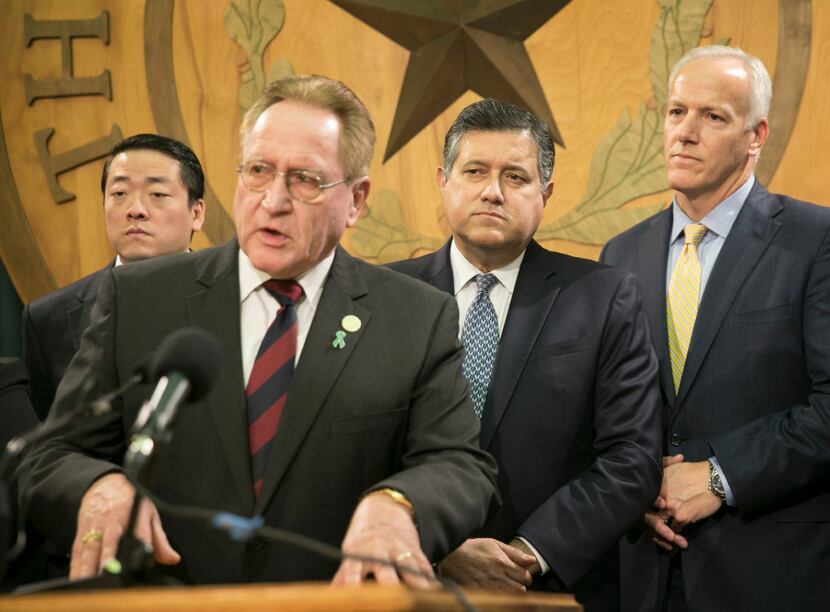 Rep. Mark Keough, R-The Woodlands (second from left) ignited passionate debate Wednesday by...