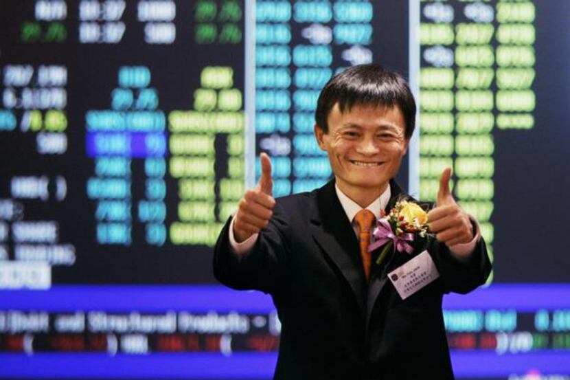 
Jack Ma, founder and CEO of Alibaba, celebrates at his company listing ceremony at the Hong...