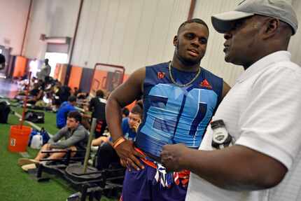 Mesquite Horn High School senior linebacker Chika Nwabuko, left, speaks with running back...