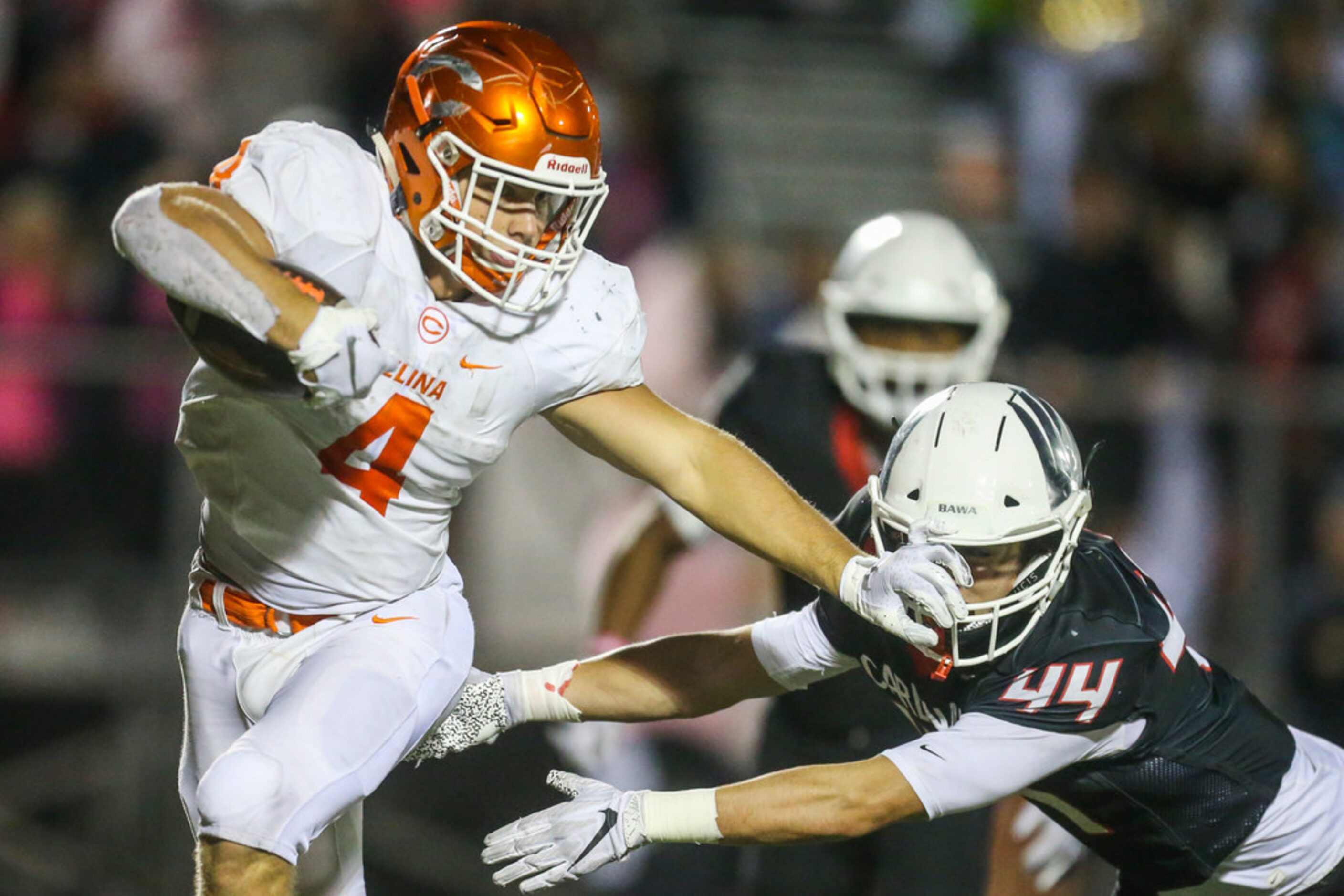 Celina running back Logan Point (4) shakes off a tackle form Melissa linebacker Parker Jack...