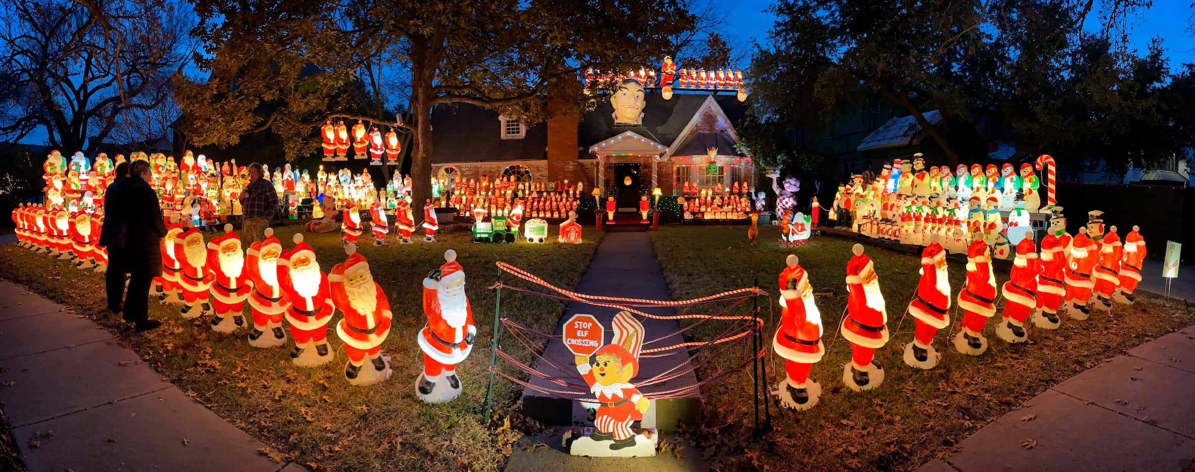 This panoramic view shows the full holiday scene of Wayne Smith's house and yard.