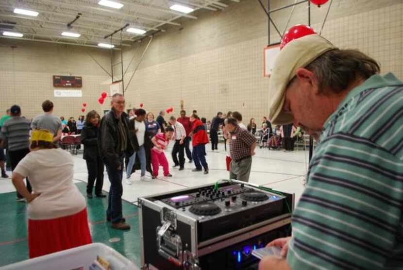 
Little Elm resident Shane Manning deejays for the dance party in the gymnasium at Memorial...