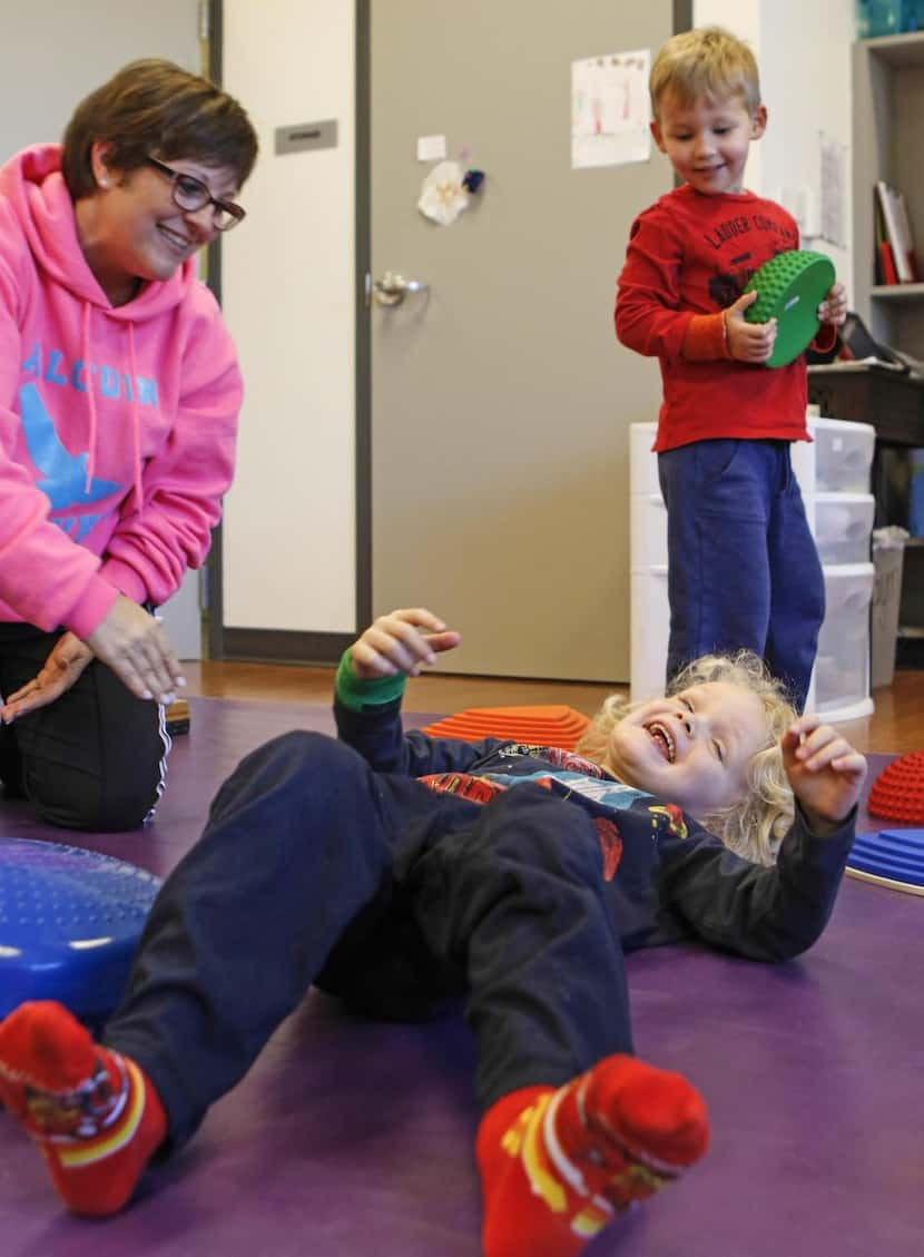 
Physical education teacher Tracy Cossey (left) laughs with primary school student Jack...