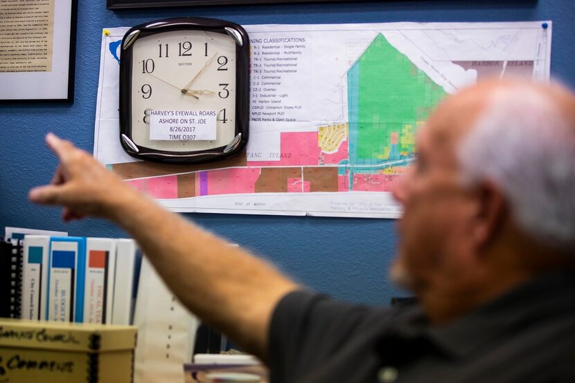 A clock behind the desk of Port Aransas Mayor Charles Bujan marks the moment Hurricane...