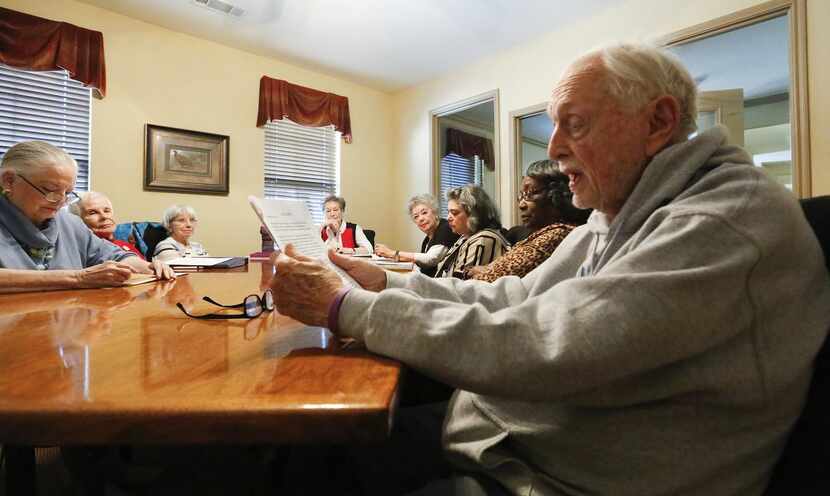 David Fletcher , 86 (right), reads his latest work to the group of six to 10 writers who...