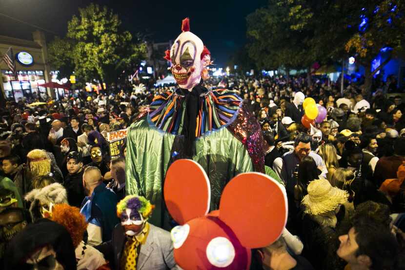 An enormous clown costume towers over the massive crowd of costumed party goers for the 2012...