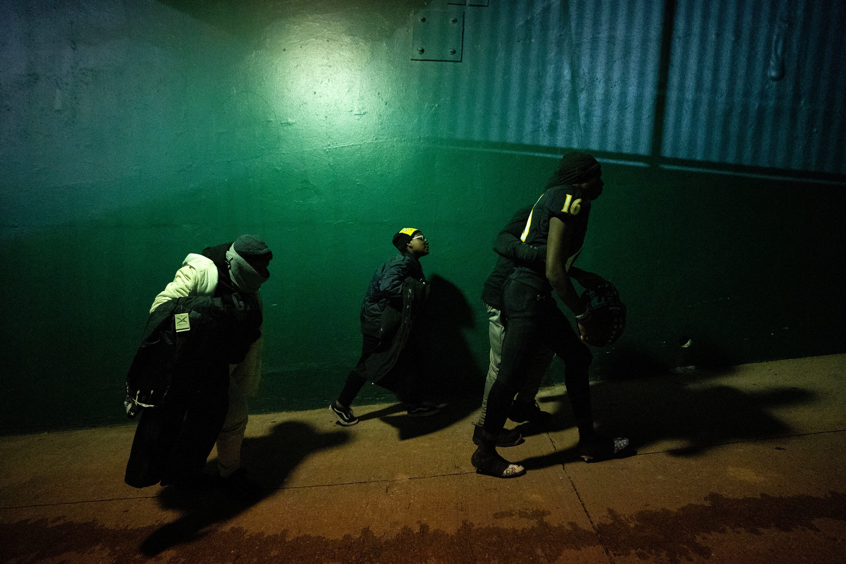 Crandall sophomore wide receiver Alex Abron (16) walks up the tunnel with his family after...