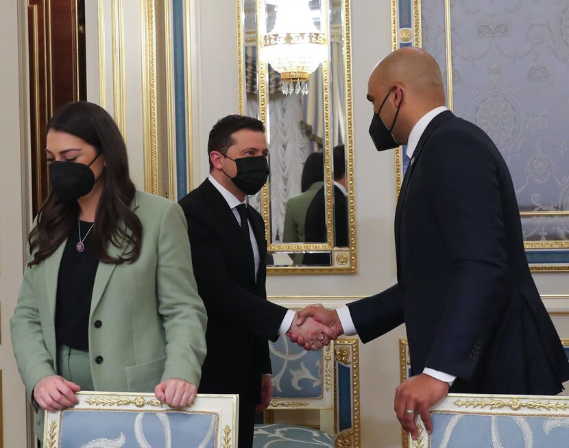 Ukraine President Volodymyr Zelensky (center) greets Rep. Colin Allred, D-Dallas, as a...