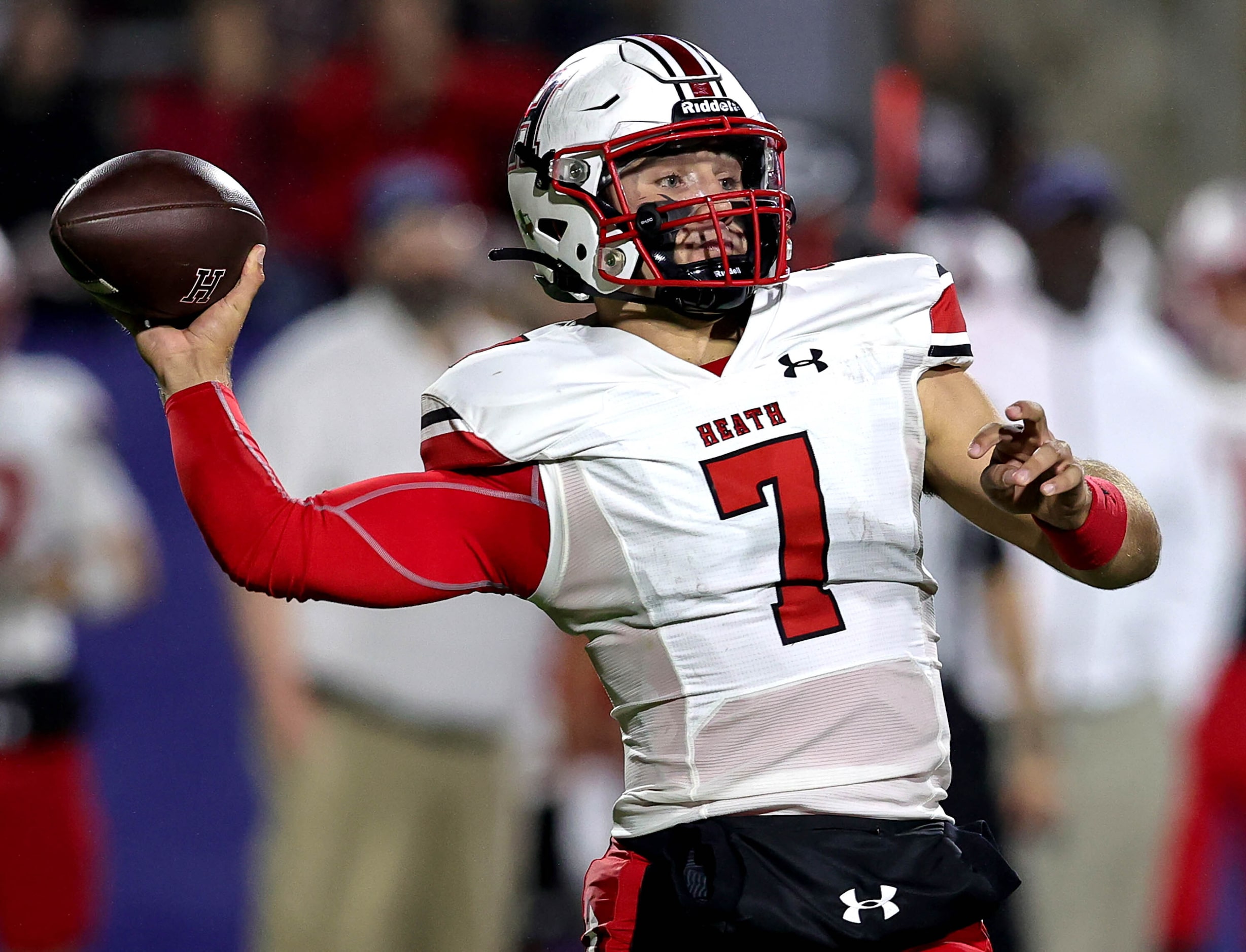 Rockwall Heath quarterback Caleb Hoover attempts a pass against Duncanville during the first...