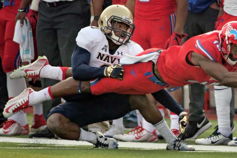 SMU receiver Courtland Sutton (16) reaches for extra yardage after a catch during the second...